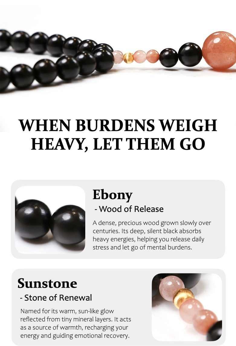 Black and pink beaded necklace with text about burdens and gemstones on a white background