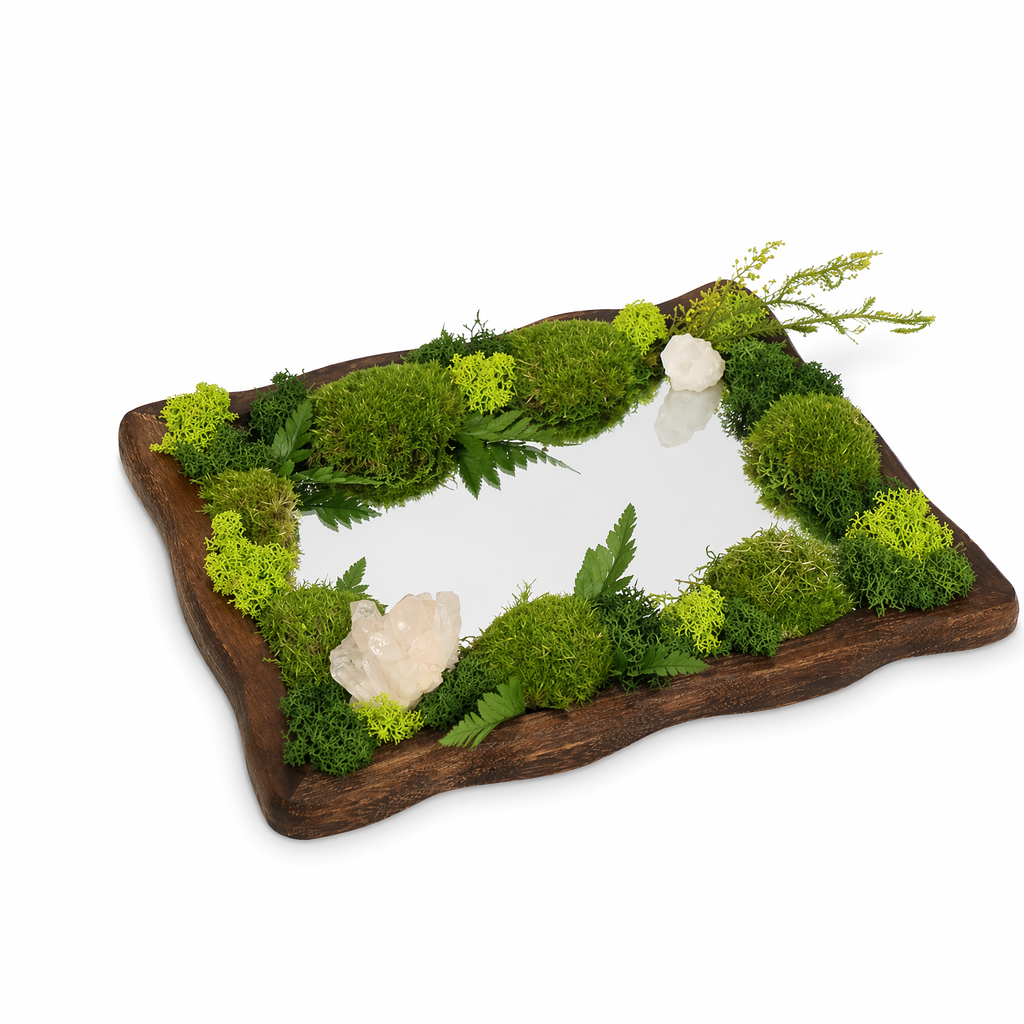 Close-up of crystal landscape mirror showing clear quartz points and moss detail