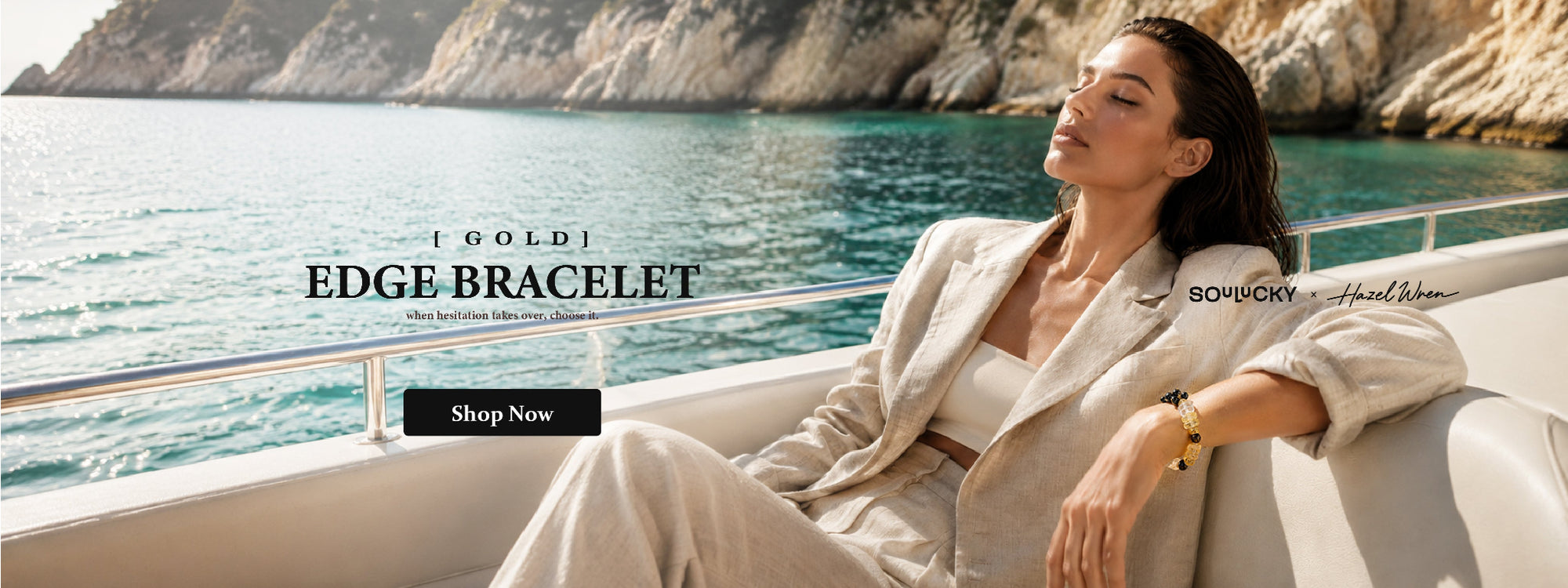 A woman reclining on a white yacht deck by the turquoise sea, wearing a gold-toned bracelet. Text on the image reads 'GOLD EDGE BRACELET' with a 'Shop Now' button, and 'BOUVRY x Henri Dumas' appears near the model.
