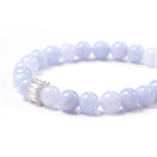 Close-up detail of beads and silvery connector on the Beluga bracelet.