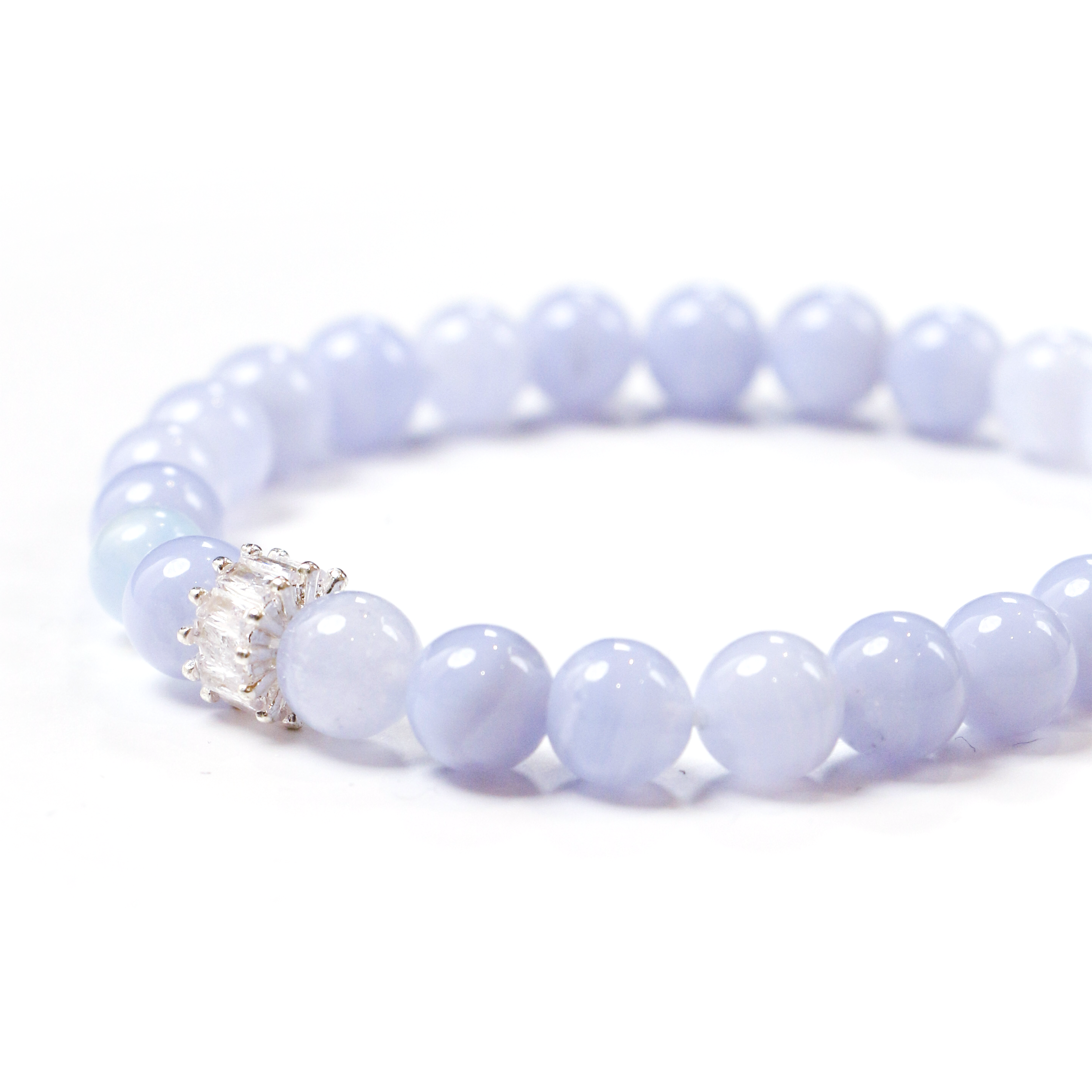 Close-up detail of beads and silvery connector on the Beluga bracelet.