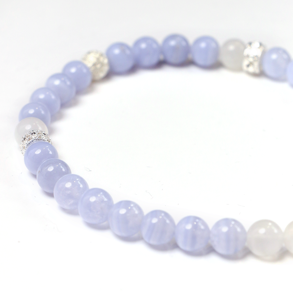 Detail of Blue Lace Agate beads and 925 Silver tassel detail close-up