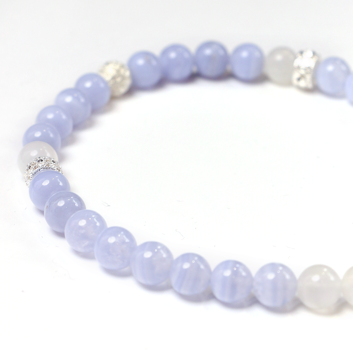 Detail of Blue Lace Agate beads and 925 Silver tassel detail close-up