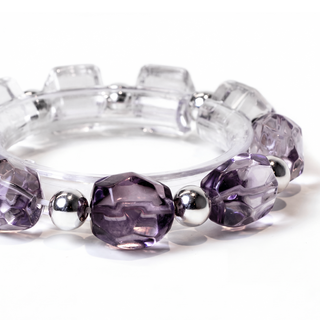 Close-up of Chrysaora Colorata bracelet showing purple crystals and clear quartz beads