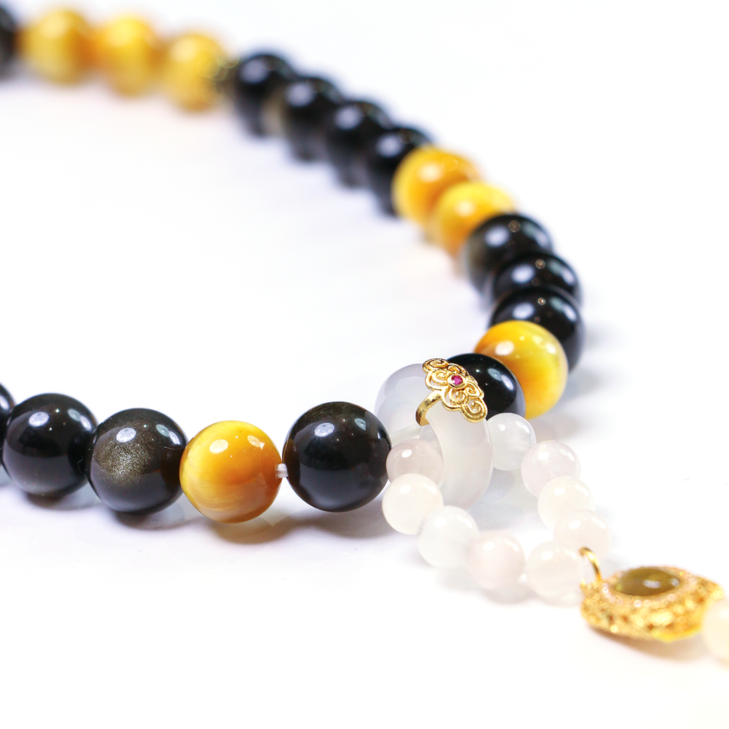 Close-up of 33 smooth meditation beads with moonstone tassel detail