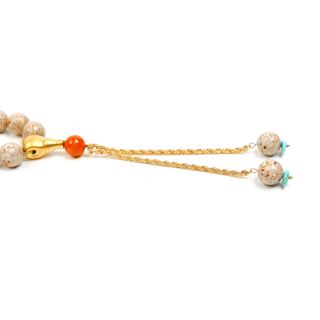 Concentration Strength bracelet with brass tassel on white background