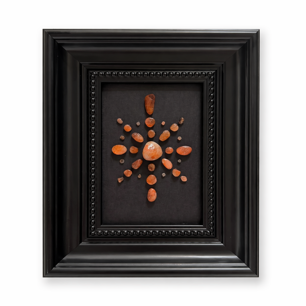 Golden sunstone crystal star frame with warm orange-gold tumbled stones on black background