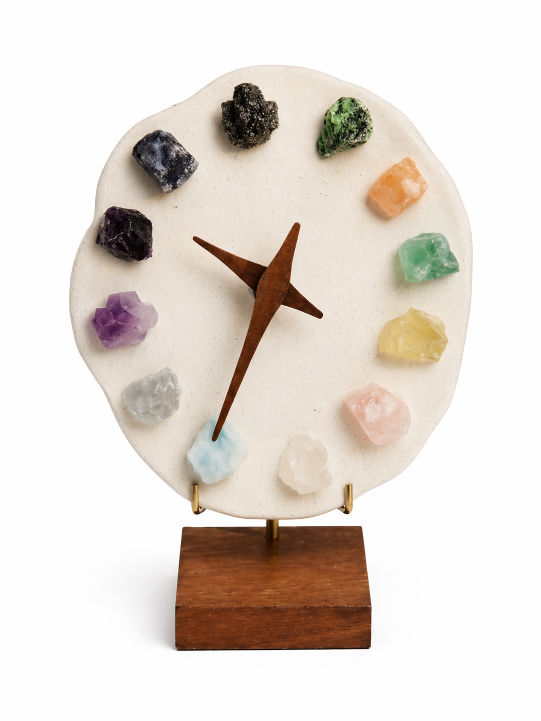 Decorative clock with colorful crystals on a white background