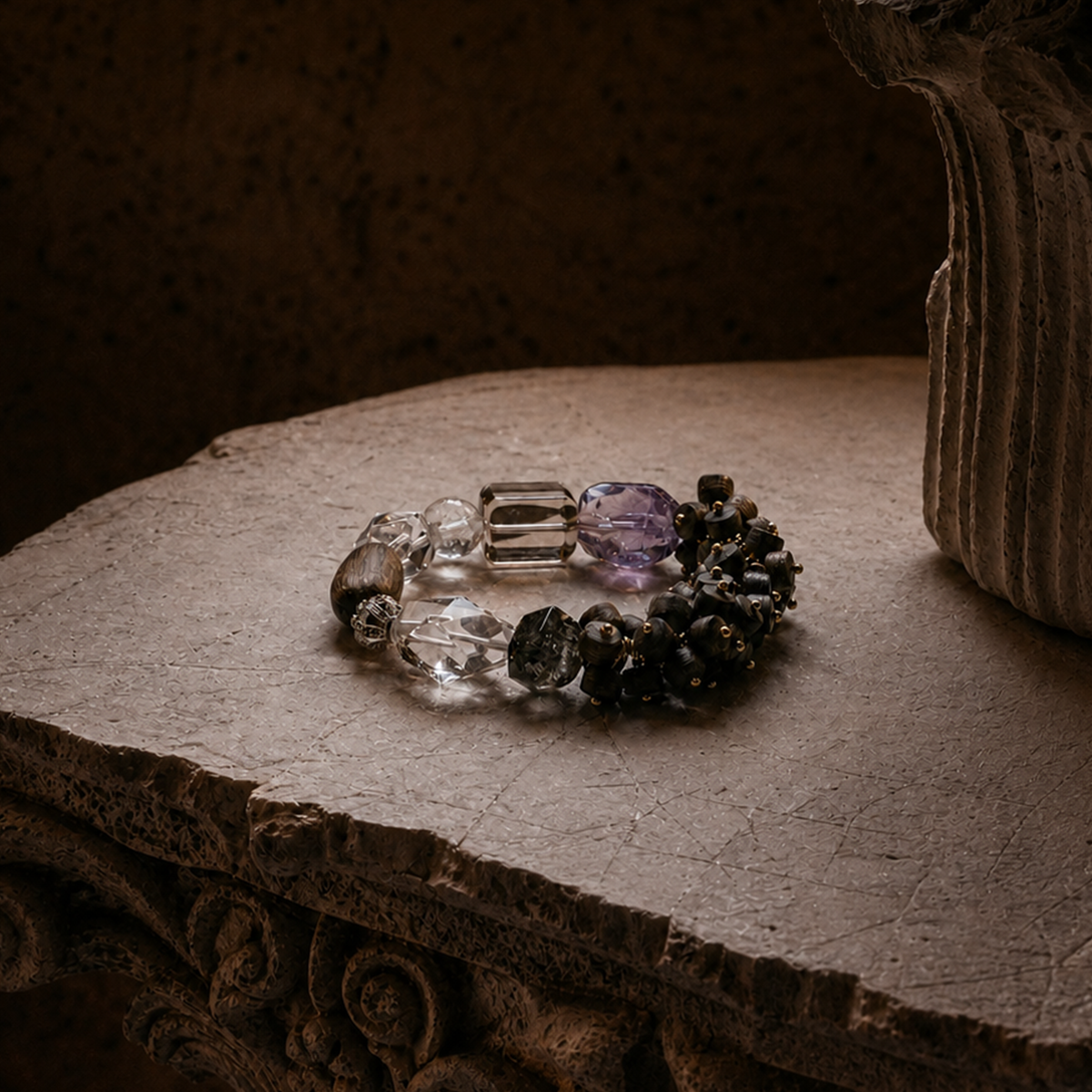 Earth Ground bracelet with Super Seven, amethyst, smoky quartz and clear quartz beads on textured surface