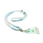 Ease + Release meditation bracelet with ocean-blue Larimar and Aquamarine beads on soft surface
