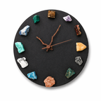 Eternal Night crystal clock with deep dark crystals on matte metal base in soft lighting
