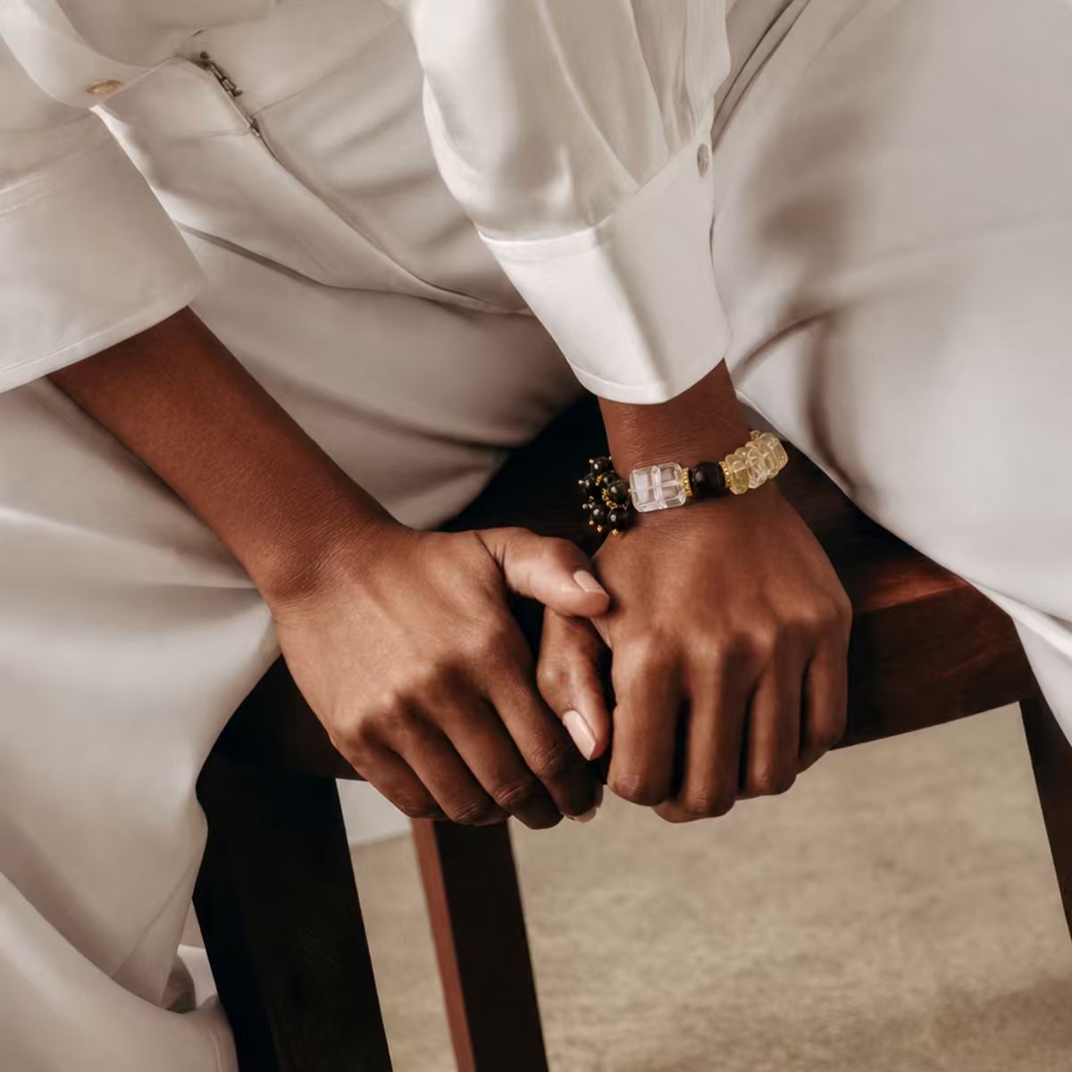 Model wearing the Gold | Edge handcrafted bracelet, styled with a crisp white button-down shirt for a sophisticated, professional look.