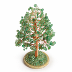Decorative tree made of green beads on a white background