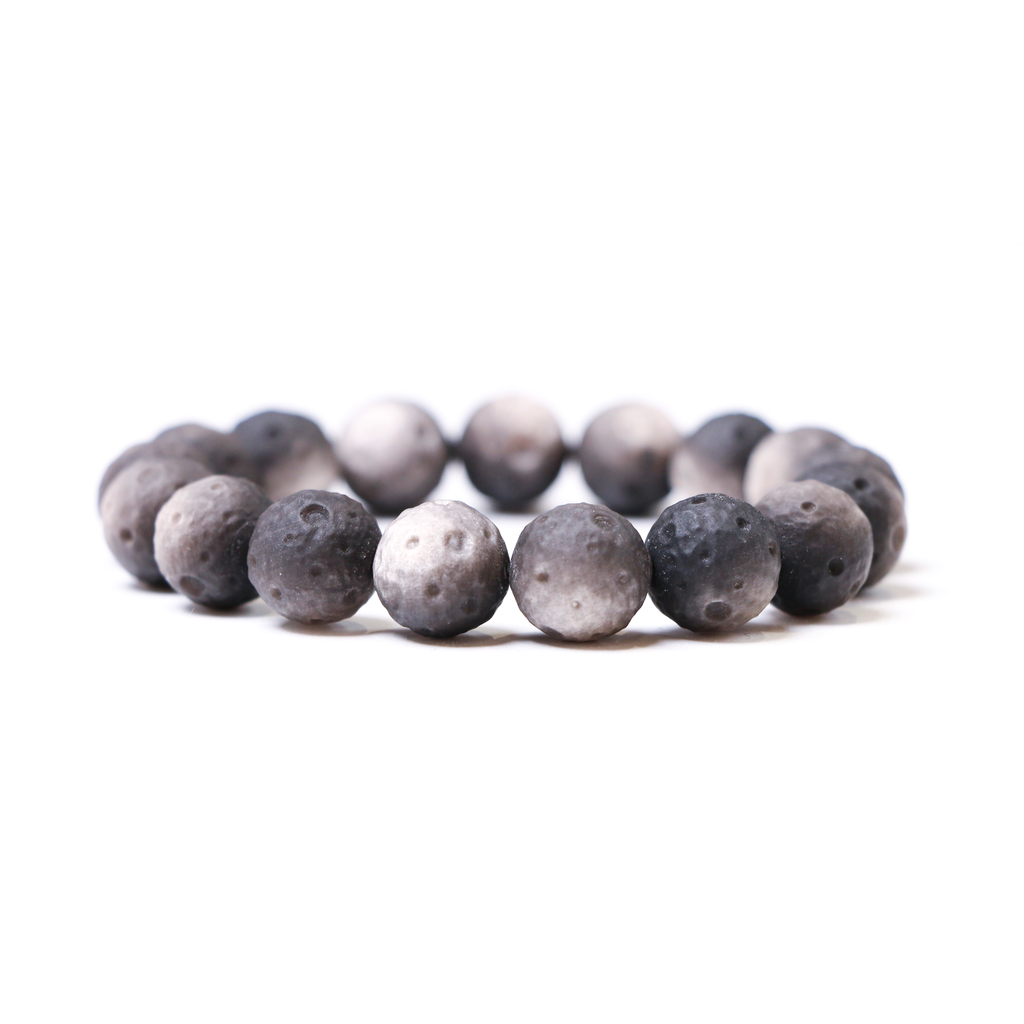 Silver obsidian lunar bead bracelet detail showing unique moon crescent shape