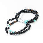 Close-up detail of transparent beads on the Peacock bracelet.