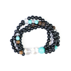Peacock bracelet with royal blue and green crystal beads representing majestic bird energy