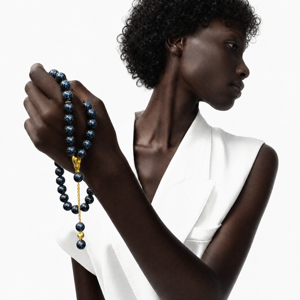 Practice + Mastery meditation bracelet with blue blackwood beads on model
