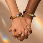 Black beaded bracelet with colored stones on a white background, featuring the brand 'Boulucky'.
