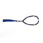 Reason + Clarity meditation bracelet with lapis lazuli and ebony beads on white background