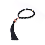 Close-up of Release Recovery bracelet showing smooth 10mm sunstone beads