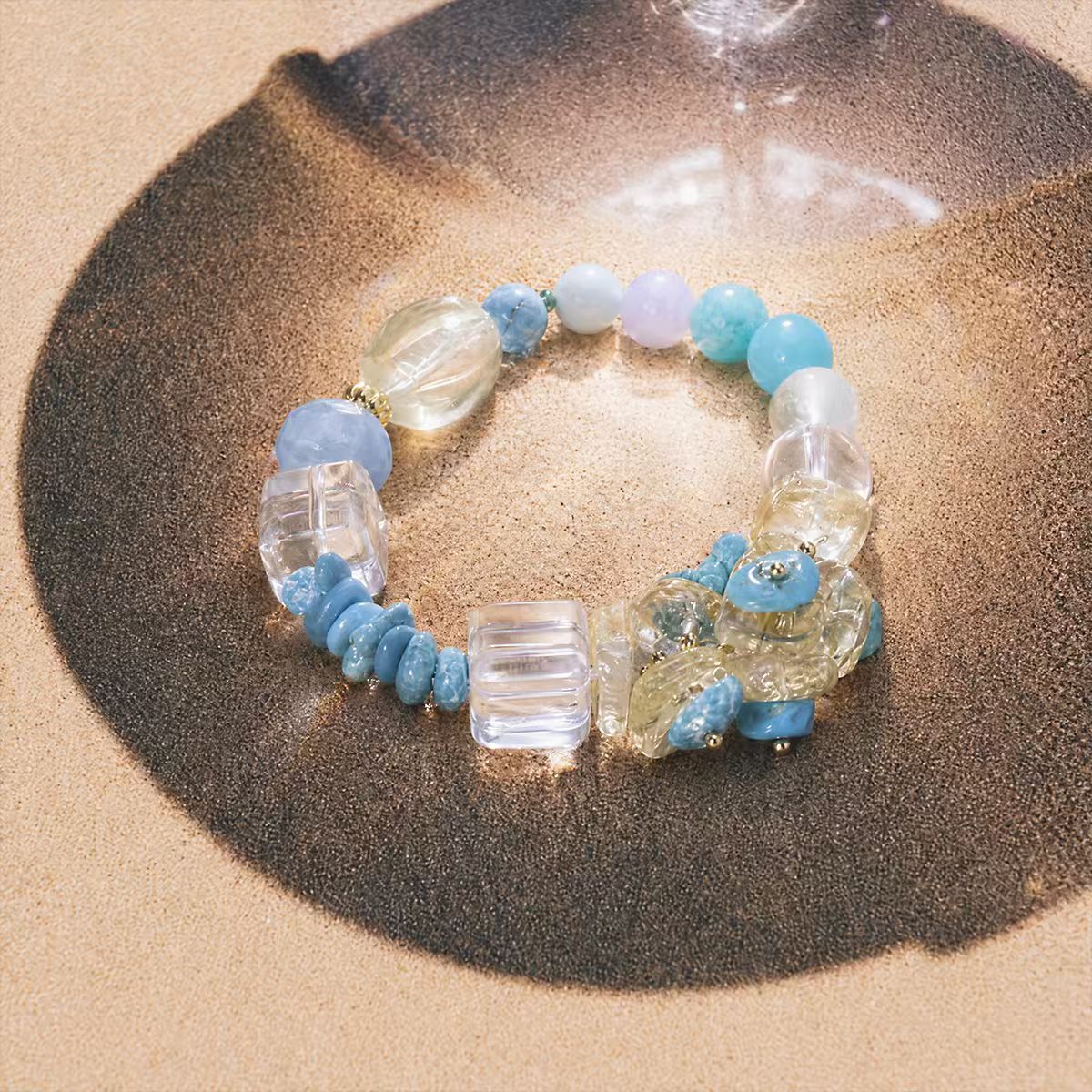 Water | Ease bracelet on sandy background with turquoise, citrine, and clear quartz beads