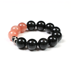 Close-up detail of black beads on the Wolf bracelet.