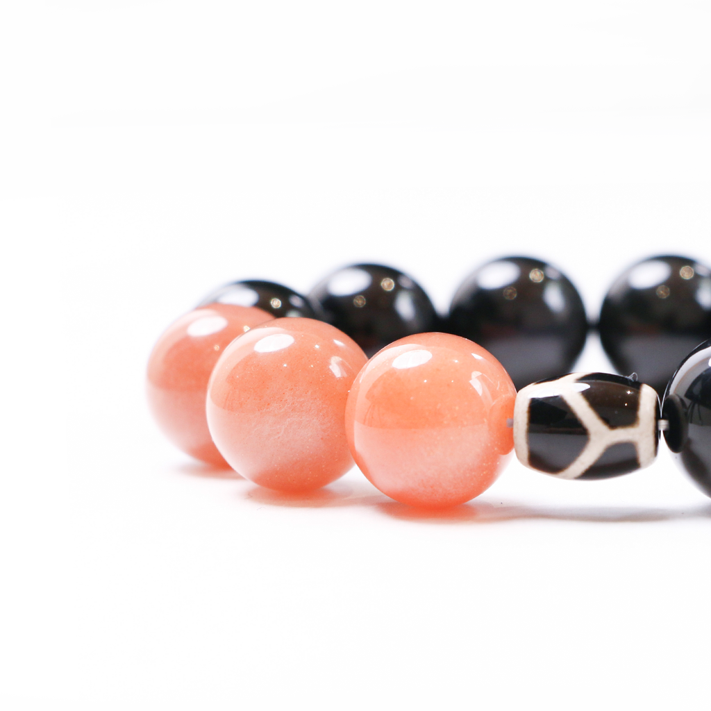 Close-up detail of pink beads on the Wolf bracelet.