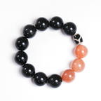 Wolf bracelet with bold 16mm sunstone and obsidian round beads on white background