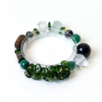 Wood | Align bracelet with green malachite and earthy gemstone beads in natural setting